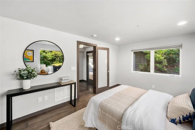 bedroom featuring recessed lighting, baseboards, and wood finished floors