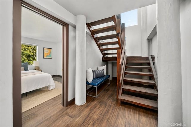 staircase featuring wood finished floors