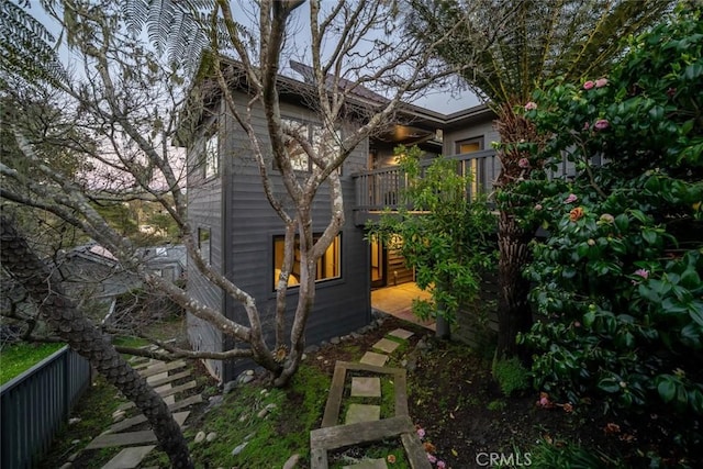 view of side of home featuring a wooden deck