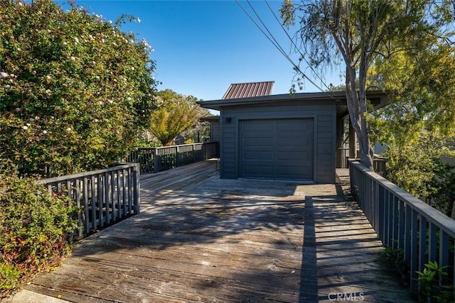 garage featuring concrete driveway