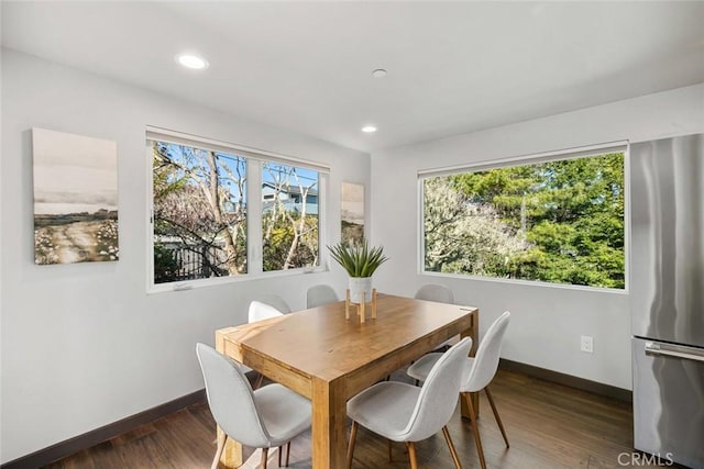 dining area with recessed lighting, baseboards, and wood finished floors