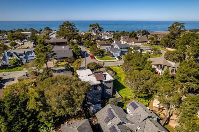 bird's eye view featuring a water view and a residential view