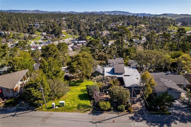 aerial view with a mountain view and a wooded view