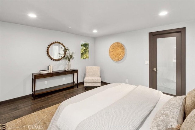 bedroom with recessed lighting, baseboards, and wood finished floors