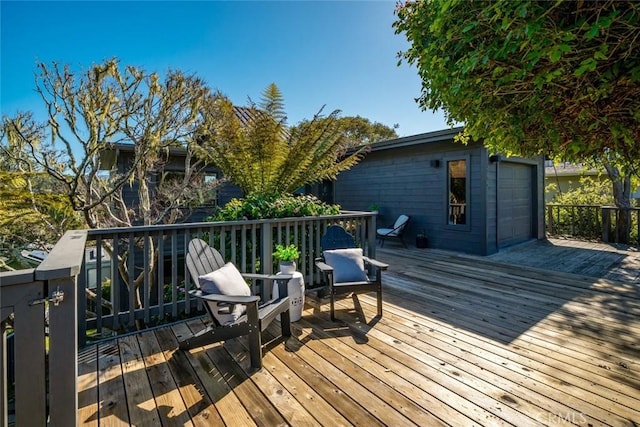 wooden deck with a garage