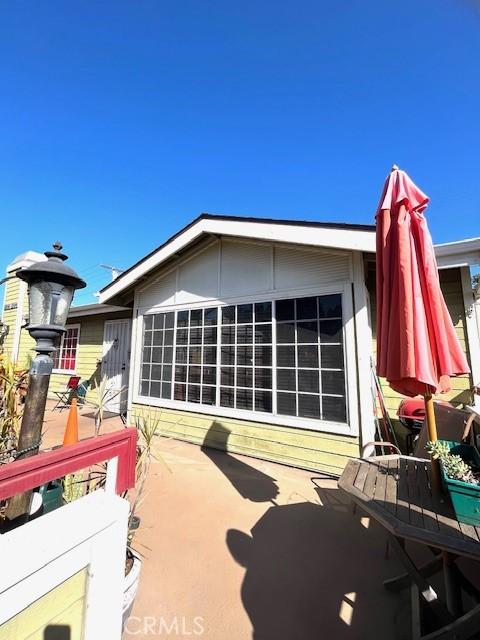 1864 Raymond Ave Unit 4, Signal Hill, CA 90755 - view of home's exterior featuring a patio area