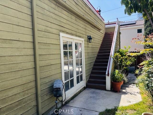 view of home's exterior featuring a patio area and stairway