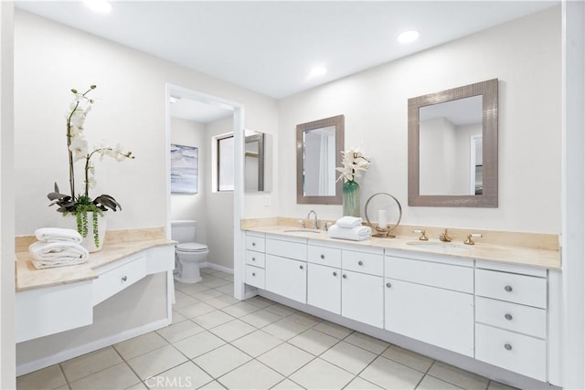 full bathroom featuring a sink, toilet, double vanity, and tile patterned flooring