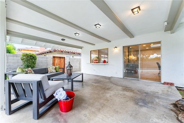 view of patio featuring outdoor lounge area and fence