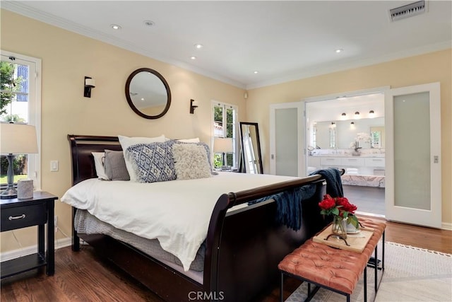 bedroom with visible vents, ornamental molding, ensuite bath, wood finished floors, and recessed lighting