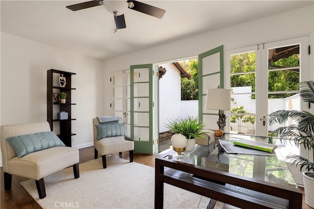 office area featuring french doors, baseboards, and a ceiling fan