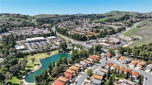 birds eye view of property featuring a water and mountain view