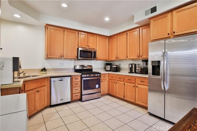 kitchen featuring recessed lighting, visible vents, appliances with stainless steel finishes, and light countertops