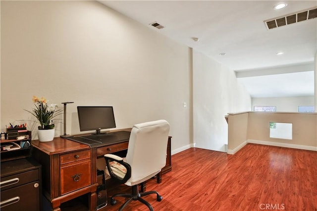 office with visible vents, recessed lighting, baseboards, and wood finished floors