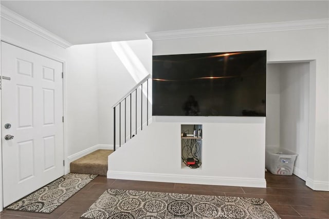 entrance foyer with stairway, ornamental molding, baseboards, and wood tiled floor