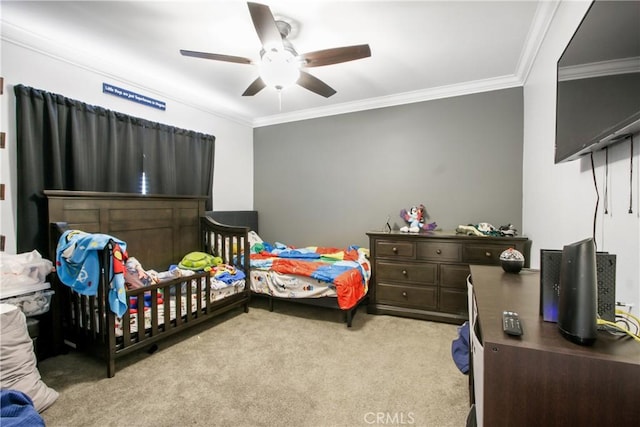 carpeted bedroom with a ceiling fan and ornamental molding