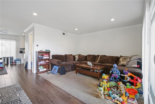 living room featuring recessed lighting, visible vents, wood finished floors, and ornamental molding