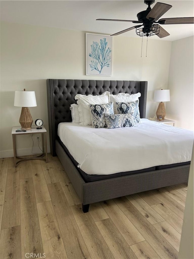 bedroom featuring light wood finished floors and ceiling fan