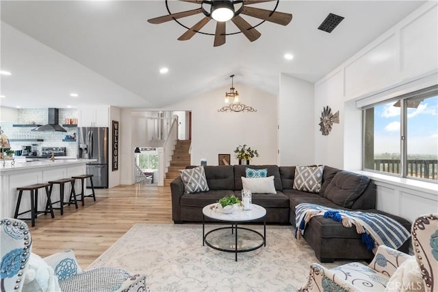 38680 Mesa Rd, Temecula, CA 92592 - living area with stairway, light wood-type flooring, a ceiling fan, recessed lighting, and lofted ceiling