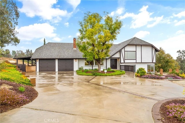 38680 Mesa Rd, Temecula, CA 92592 - view of front of house featuring a chimney, driveway, an attached garage, and a shingled roof