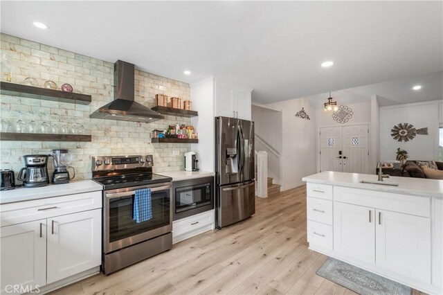 38680 Mesa Rd, Temecula, CA 92592 - kitchen with appliances with stainless steel finishes, wall chimney range hood, open shelves, a sink, and decorative backsplash