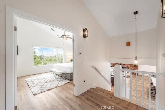 38680 Mesa Rd, Temecula, CA 92592 - hallway featuring vaulted ceiling, an upstairs landing, and wood finished floors