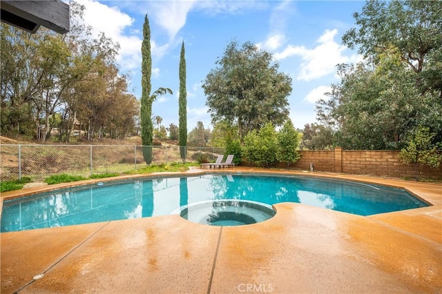 38680 Mesa Rd, Temecula, CA 92592 - view of swimming pool featuring a fenced backyard, a patio area, and a pool with connected hot tub