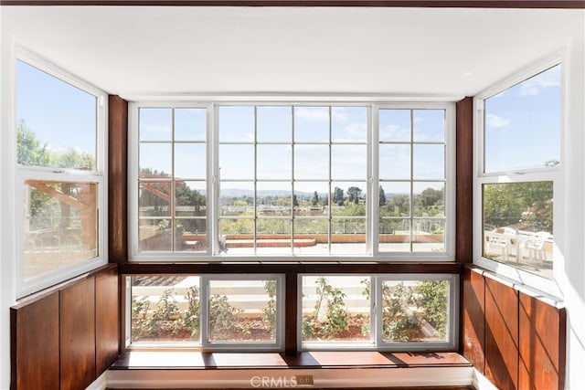 unfurnished sunroom featuring plenty of natural light