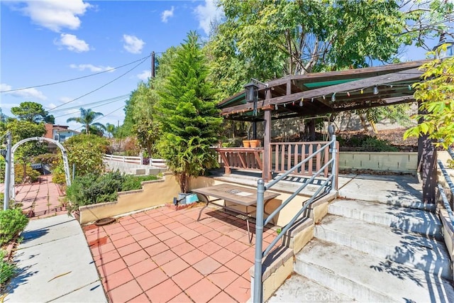 view of patio / terrace featuring fence