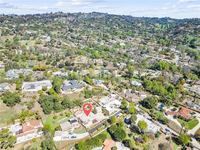 birds eye view of property with a residential view