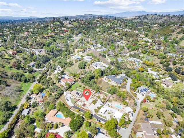 aerial view featuring a mountain view and a residential view