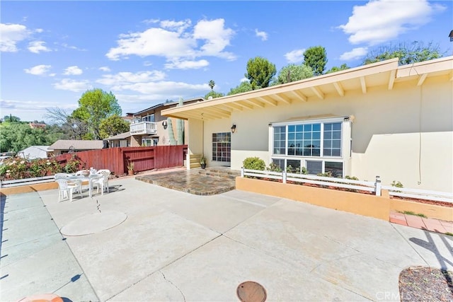 view of patio / terrace featuring fence