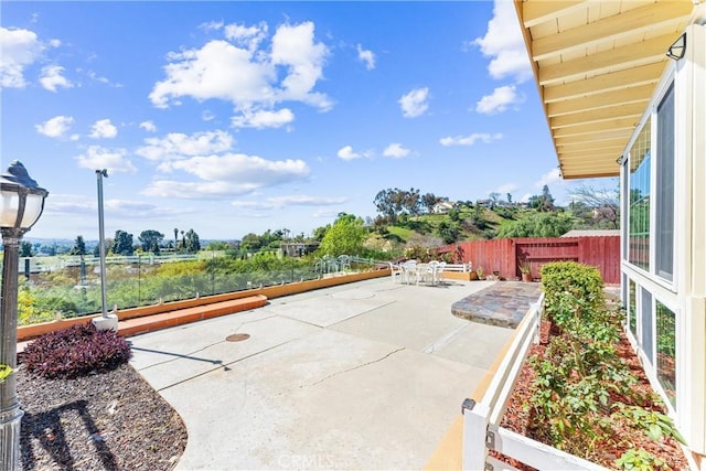 view of patio / terrace with outdoor dining space and fence