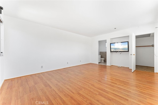 unfurnished living room with light wood finished floors