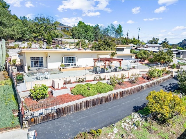 exterior space featuring stucco siding, fence, and a patio area