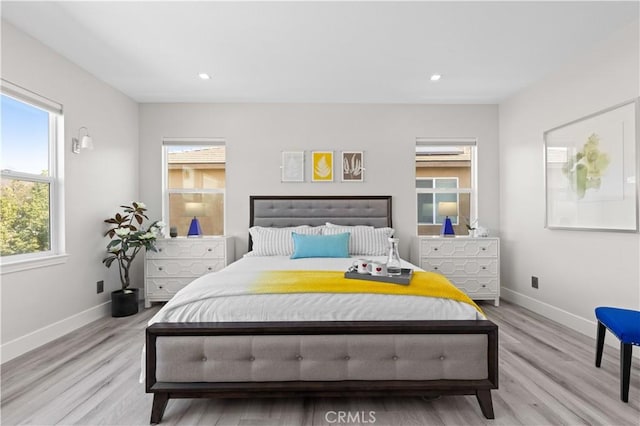 bedroom featuring recessed lighting, light wood-style floors, and baseboards