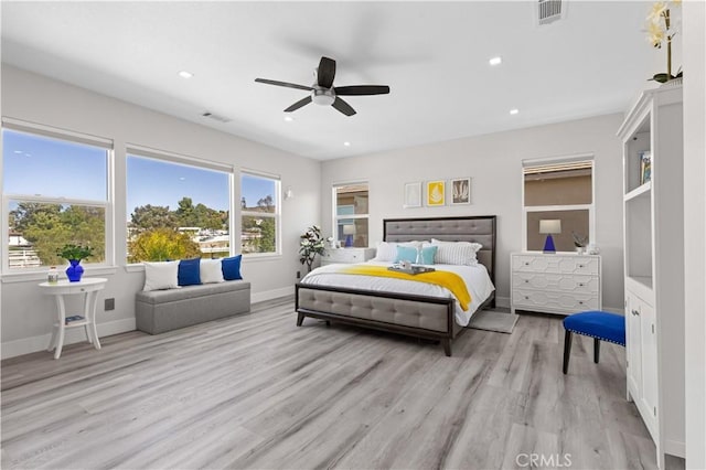 bedroom with recessed lighting, visible vents, and light wood-type flooring