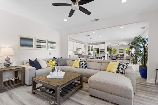 living room featuring visible vents, recessed lighting, and ceiling fan