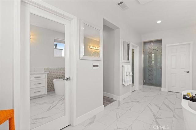 interior space featuring visible vents, baseboards, and marble finish floor