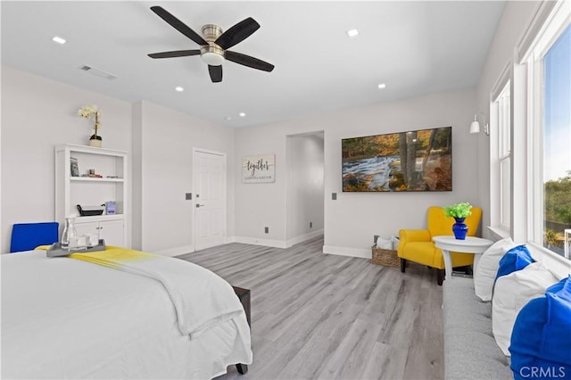 bedroom with a ceiling fan, visible vents, baseboards, recessed lighting, and light wood-style floors