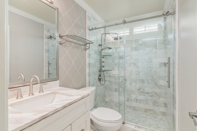 bathroom featuring toilet, vanity, wallpapered walls, and a shower stall