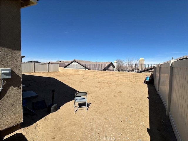 view of yard with a fenced backyard