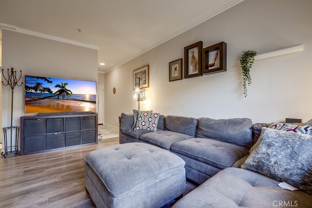 living area with ornamental molding, baseboards, recessed lighting, and wood finished floors