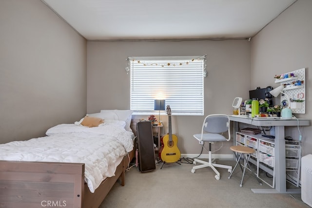 carpeted bedroom with baseboards
