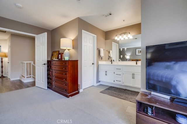 full bath featuring visible vents, baseboards, and double vanity
