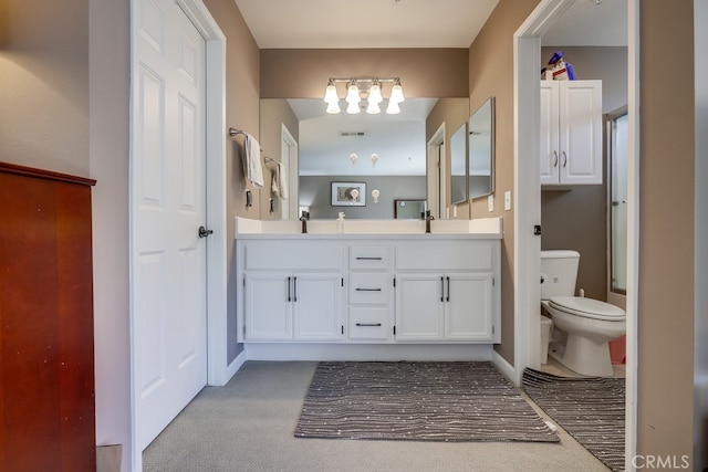 full bathroom with visible vents, baseboards, an inviting chandelier, toilet, and double vanity