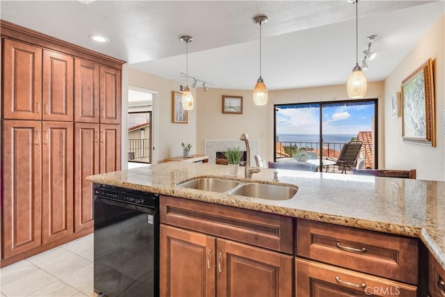 kitchen featuring light tile patterned floors, brown cabinets, dishwasher, and a sink