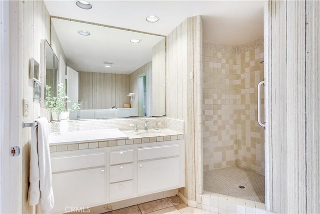 full bathroom featuring tile patterned floors, vanity, recessed lighting, and a shower stall