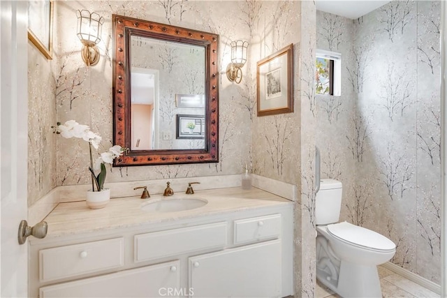 bathroom featuring toilet and vanity