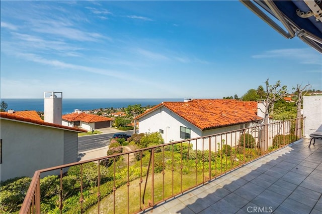 balcony featuring a water view